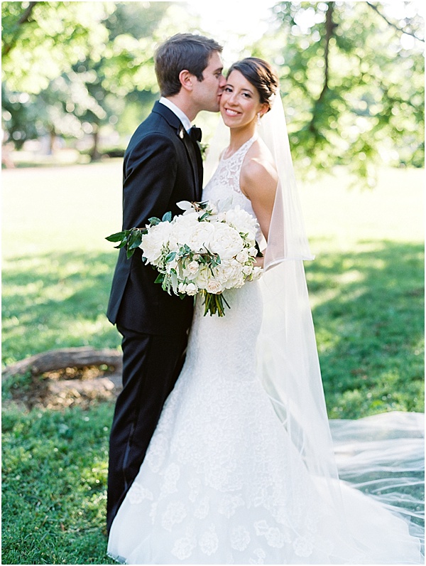 Groom Kissing Bride Lace Wedding Dress © Bonnie Sen Photography