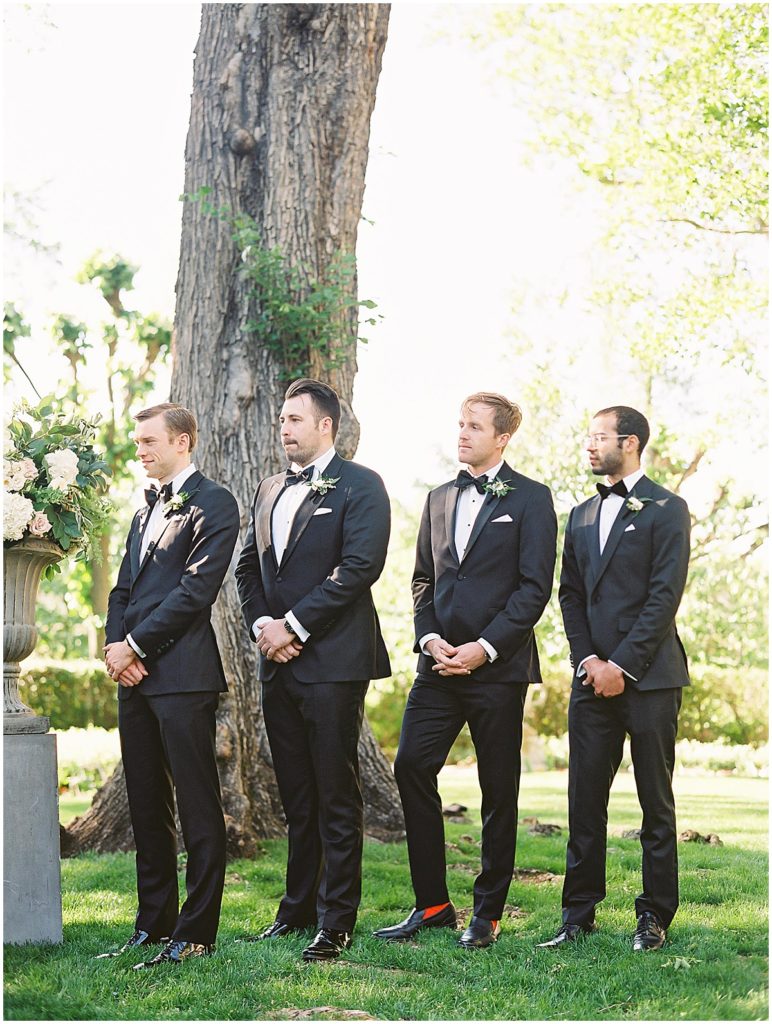 Groomsmen in Black Tuxes Outdoor Wedding Ceremony © Bonnie Sen Photography