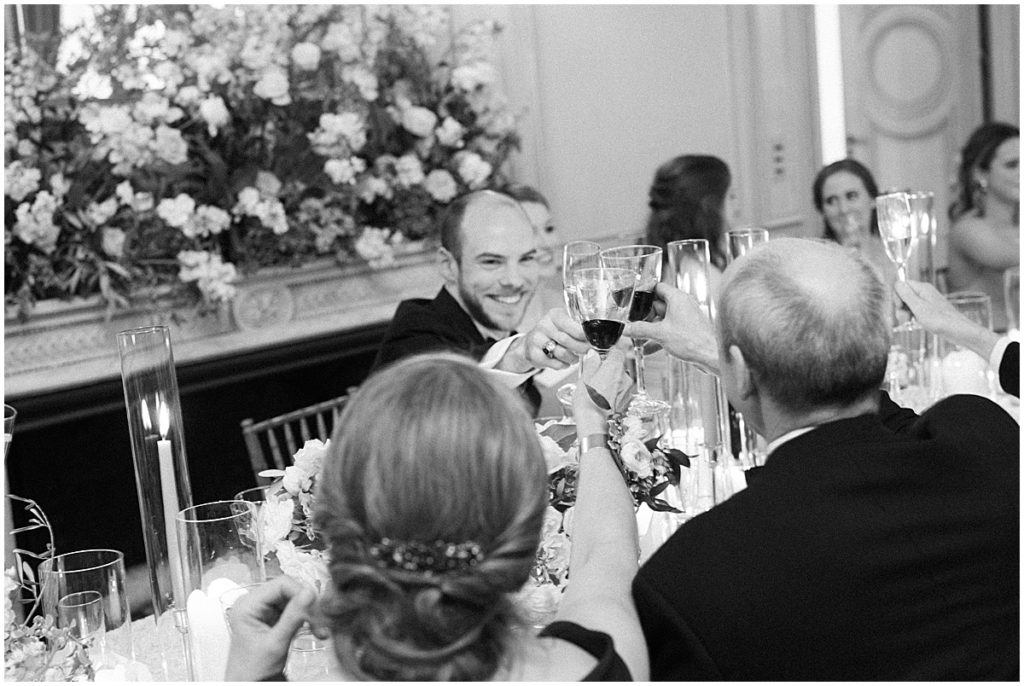 Wedding Guests Toasting Black and White Fine Art Film Wedding Photographer Denver © Bonnie Sen Photography